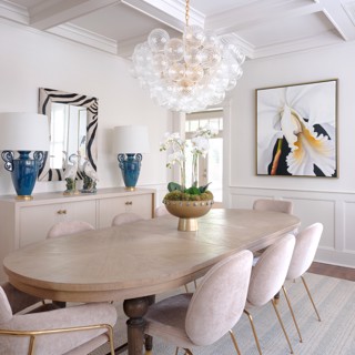 Lyda Laneville's work, White Orchid, blends perfectly with the understated glamour of this dining room. Designer: Selena Adams of Spruce, Photo: Ross Group Creative Lyda Laneville's work, White Orchid, blends perfectly with the understated glamour of this dining room. Designer: Selena Adams of Spruce, Photo: Ross Group Creative