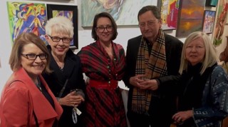 Fellow artists and art collectors join New Elements Gallery owner Miriam Oehrlein in conversation during a Friday Night Gallery Walk. Fellow artists and art collectors join New Elements Gallery owner Miriam Oehrlein in conversation during a Friday Night Gallery Walk.