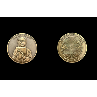Matthew Snider, MARKET SAVANT™ Commemorative Coin: front and reverse of a brass Market Savant coin showing Peter Tuchman’s portrait and commemorative lettering.