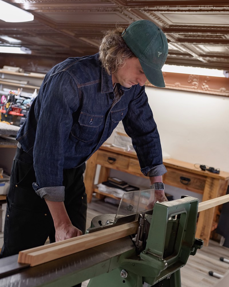 Our framer cutting a length of moulding on the saw