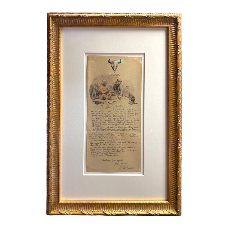 Handwritten letter in a gold frame