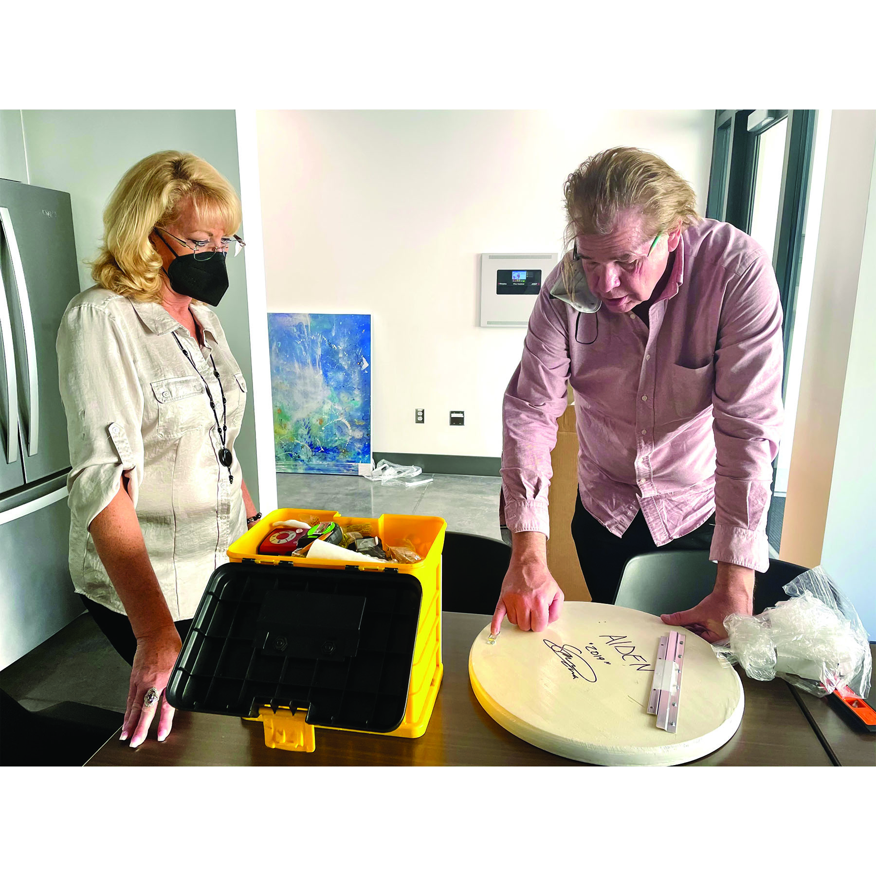 Gallery director Michael Murphy and production manager Colleen Justin plan an art installation